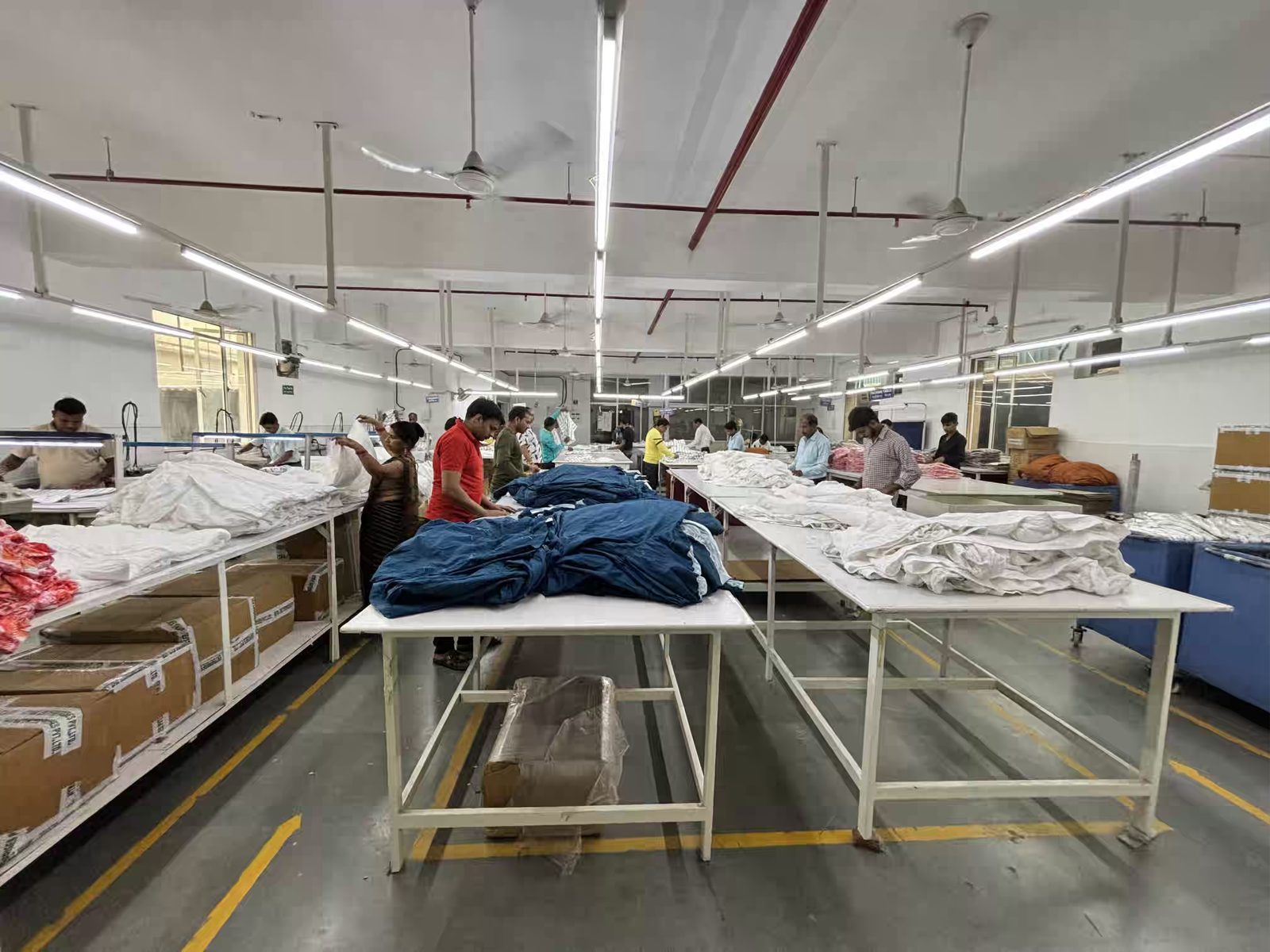 Finishing and packing floor at Myra Enterprises garment factory in Noida