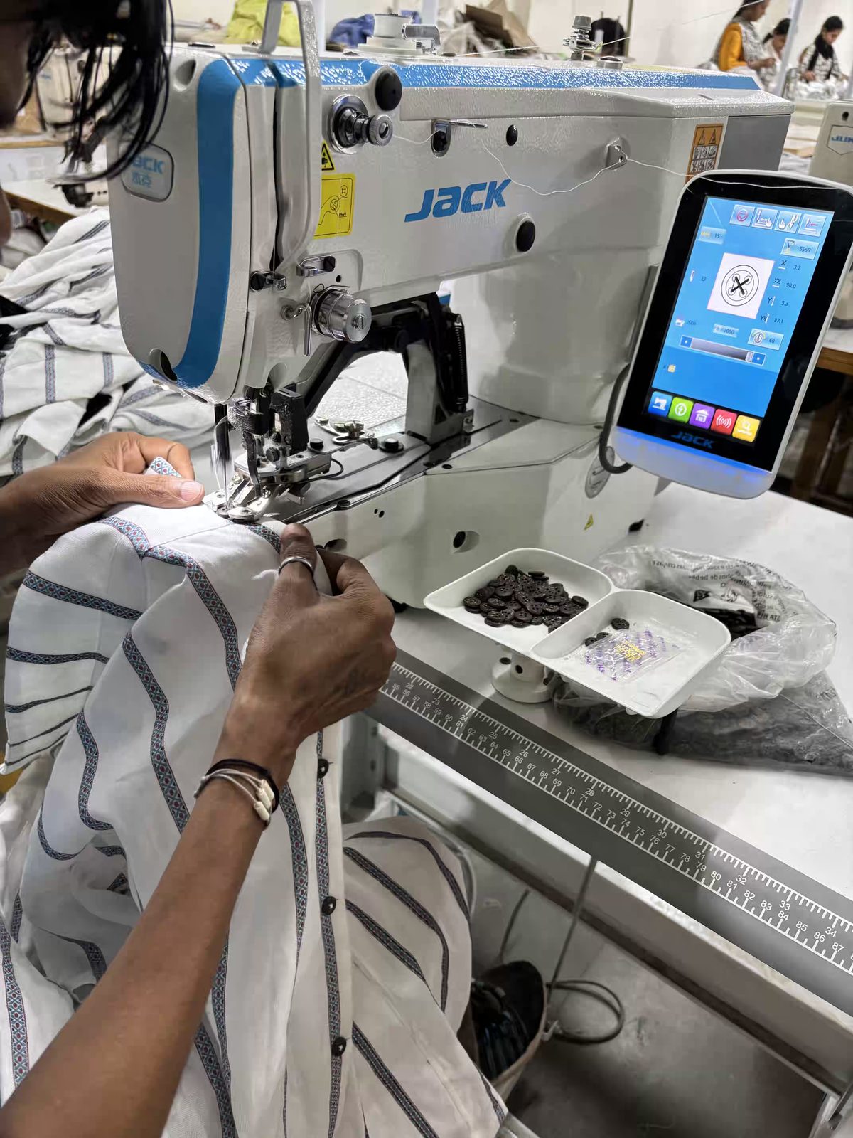 Jack industrial sewing machine stitching a garment at Myra Enterprises