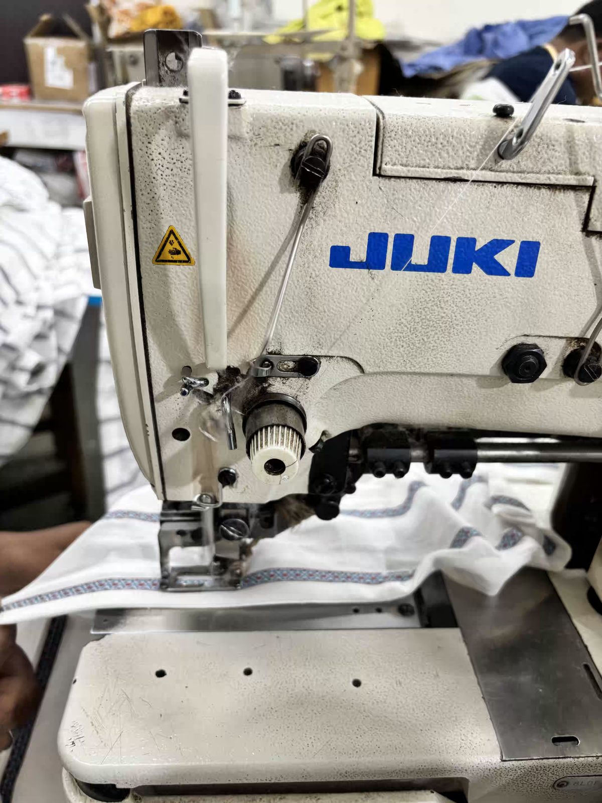 Juki industrial sewing machine in use at Myra Enterprises garment factory