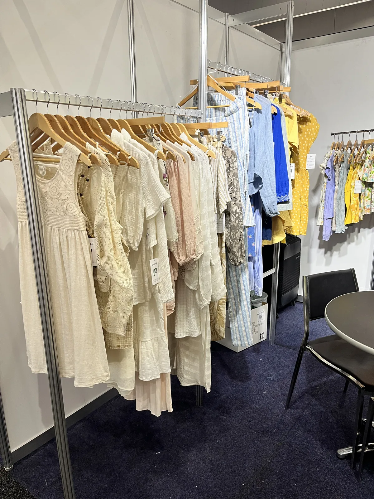 Rail of embroidered and pastel womenswear samples, Global Sourcing Expo Melbourne 2023