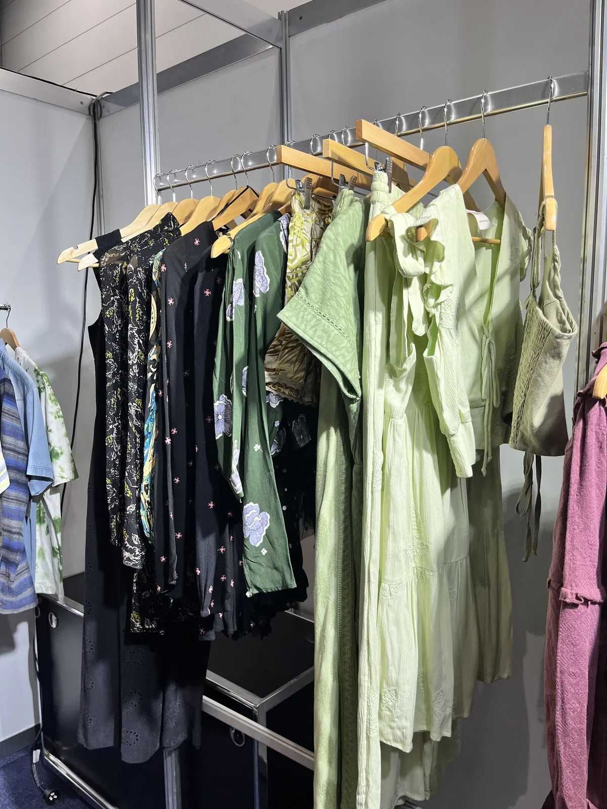 Green and black womenswear samples on the rail, Melbourne 2023