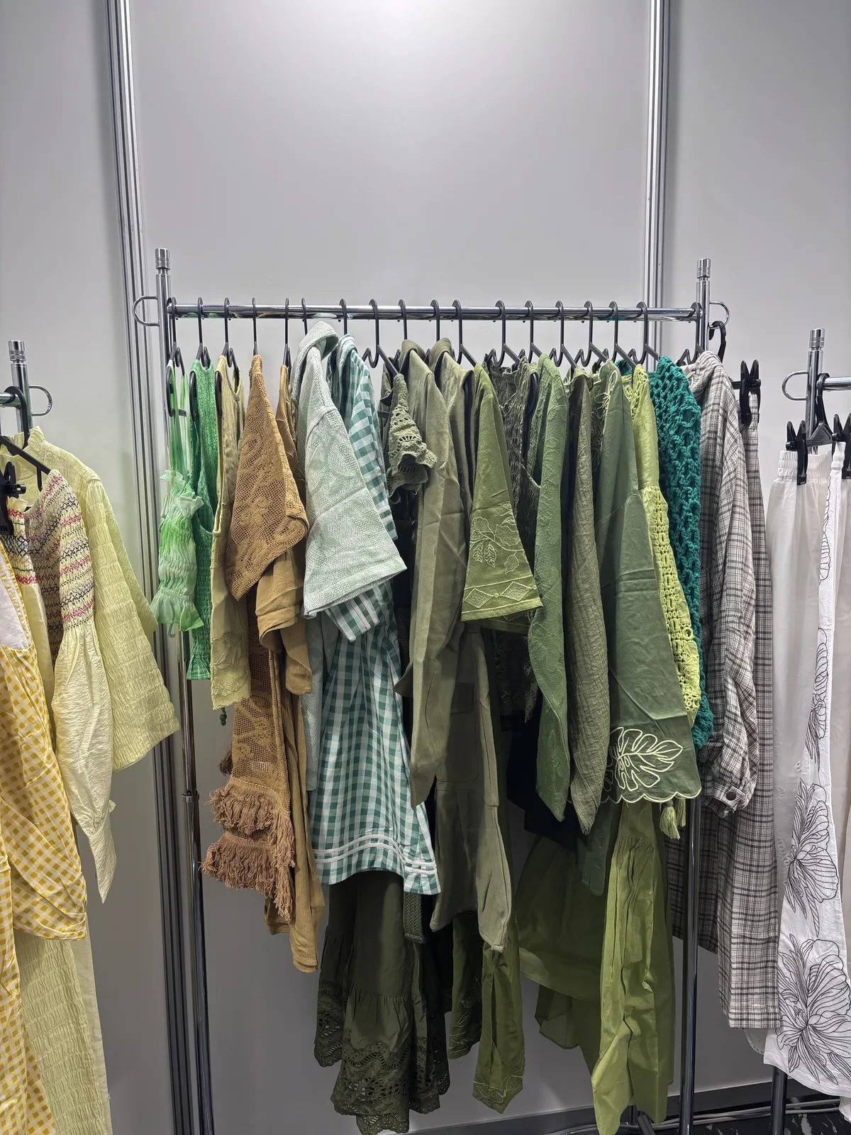 Green womenswear collection on the rail, Tokyo 2026