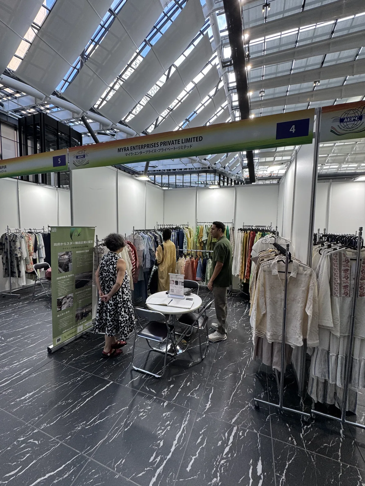 Buyers reviewing samples at the Myra Enterprises stand, Tokyo 2026