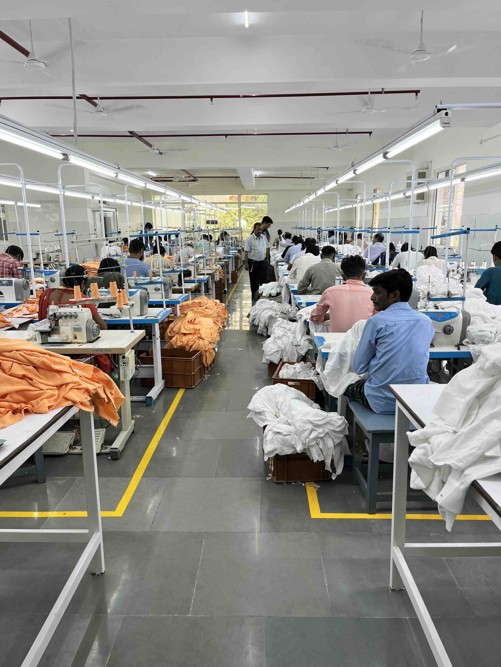 Sewing line in production at Myra Enterprises garment factory in Noida, India